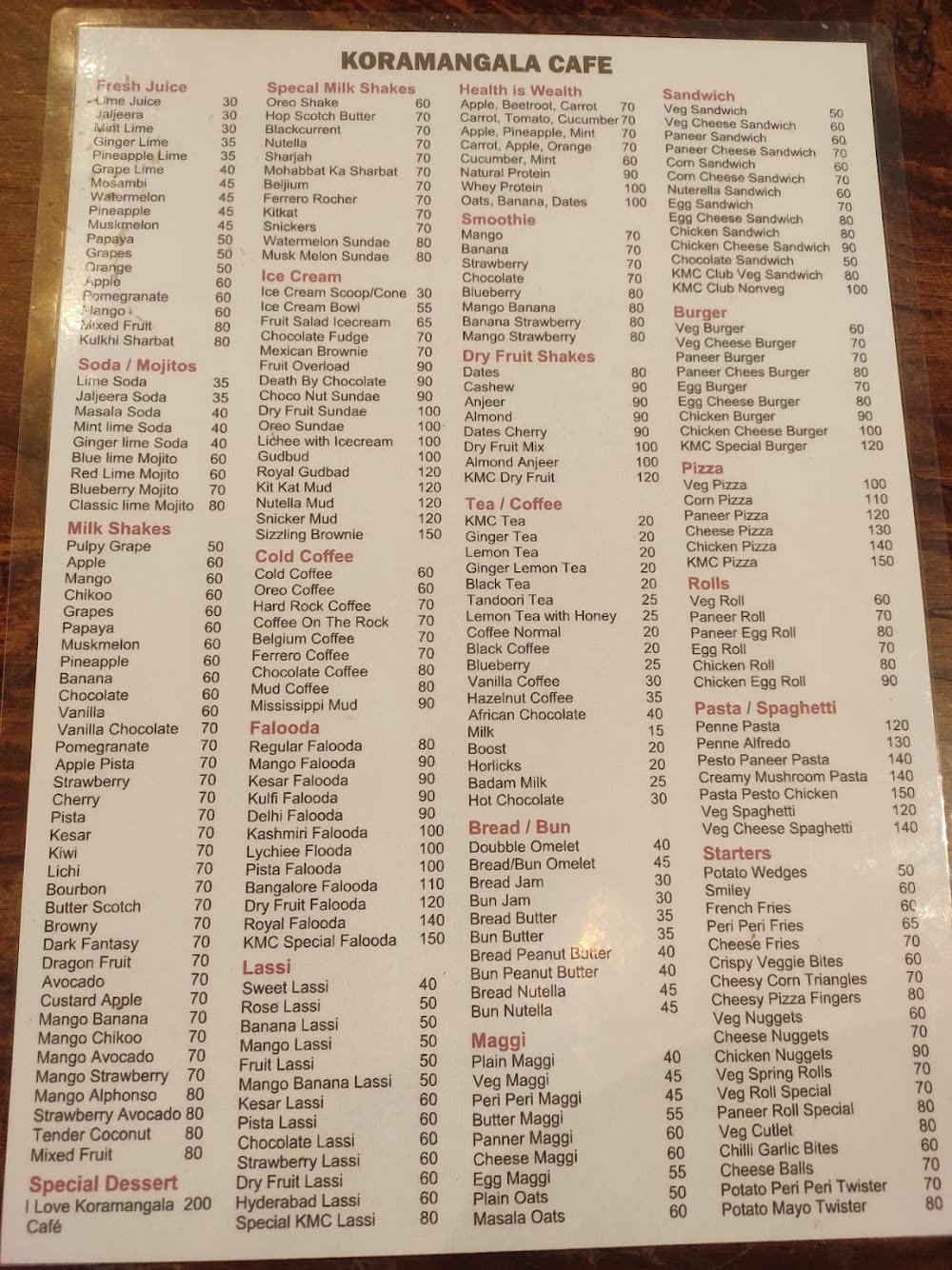 Photo of the Koramangala Cafe printed menu board with prices